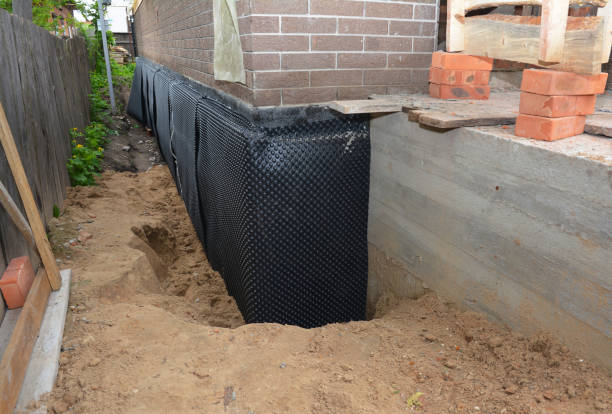 Happy homeowners after waterproofing job in Red Creek